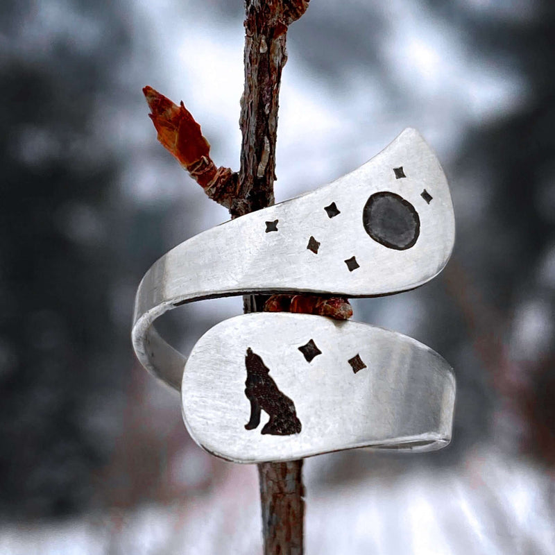 Howl Adjustable Ring features wolf, moon, and stars engravings in a stunning matte silver finish.