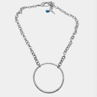 Hula Necklace featuring a sterling silver coated circle hoop and adjustable chain, perfect for a standout look.