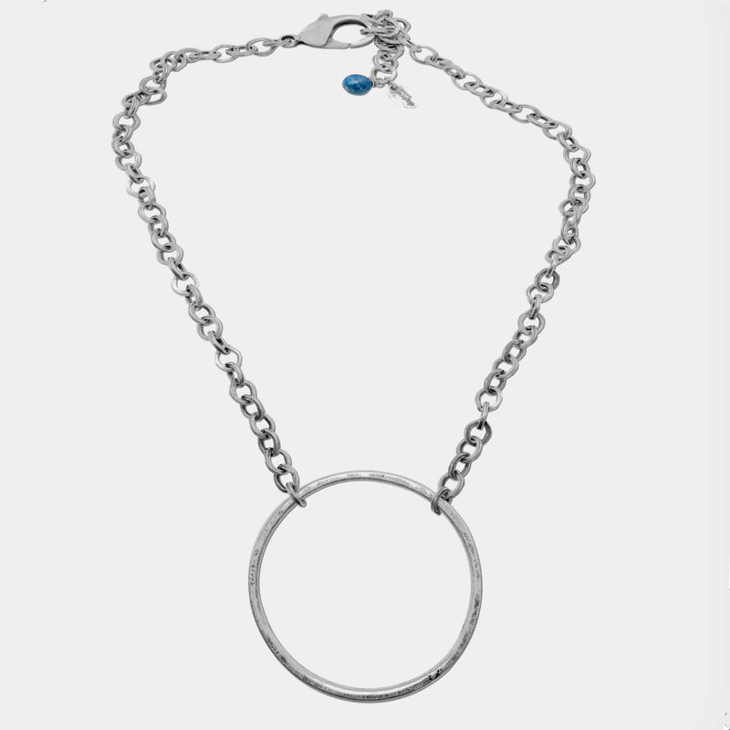 Hula Necklace featuring a sterling silver coated circle hoop and adjustable chain, perfect for a standout look.
