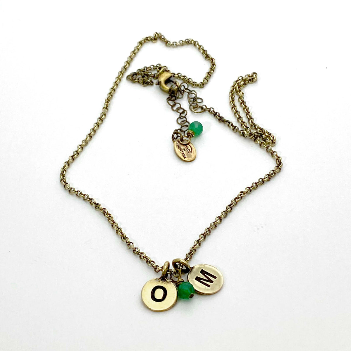 Initial Necklace with personalized OM initials and green beads on antique brass chain.