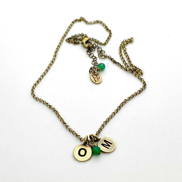 Initial Necklace with personalized OM initials and green beads on antique brass chain.