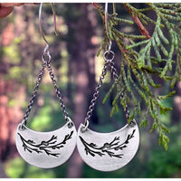 Juniper Earrings -Flowery Branch Nature dangle earrings showcasing etched juniper sprigs on raw brass with silver finish.