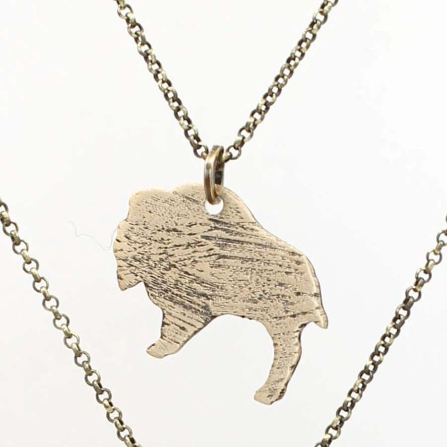 Just Roaming Long Layered Necklace featuring a hammered bison silhouette on an adjustable chain.