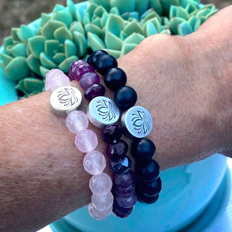Lotus Stretch Bracelet - Gemstone Beaded Stretchy Bracelet worn on wrist with serene background and succulent.