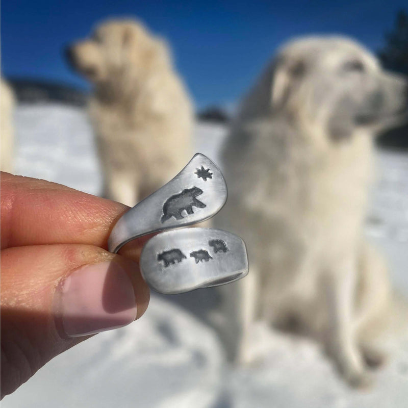 Mama and Cubs Adjustable Ring showcased with bear designs in a snowy outdoor setting.