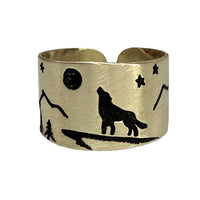 Midnight Wolf Adjustable Ring featuring a detailed wolf design with mountains and stars on a brass finish.