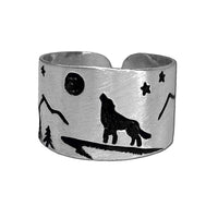 Midnight Wolf Adjustable Ring featuring a wolf, mountains, and stars design in matte silver finish.