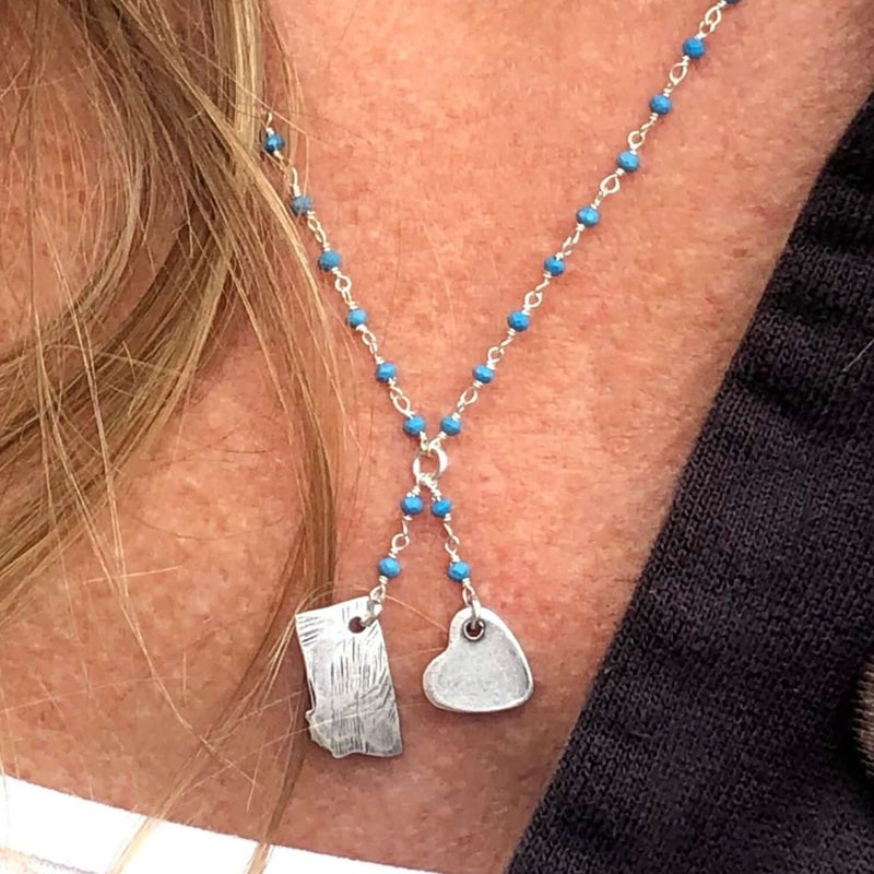 Montana Lariat Necklace featuring Montana State outline and heart charm on a turquoise beaded chain.