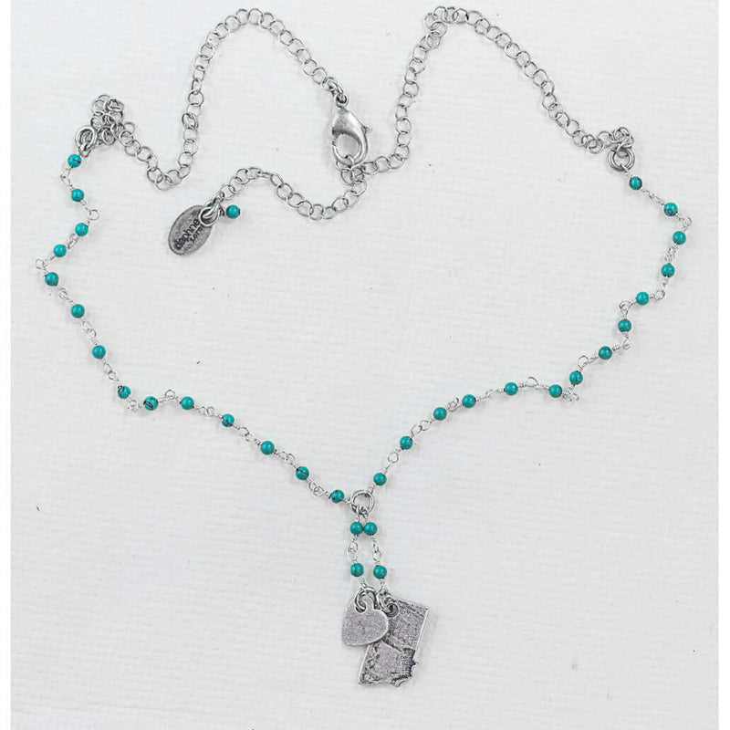 Montana Lariat Necklace featuring a Montana State outline in silver on a turquoise beaded chain.