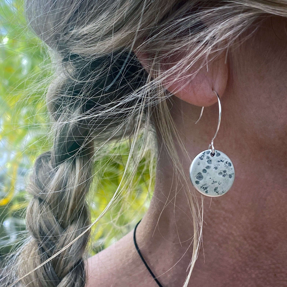 Moon Drops Earrings showcasing hammered raw brass disk, perfect for everyday wear with natural background.