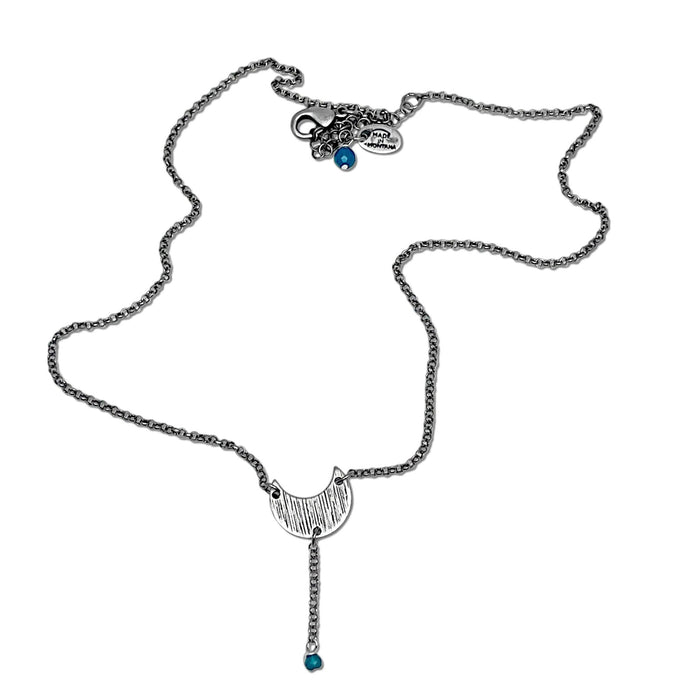 Moonbeam Y Necklace featuring a unique textured design resembling the Moon's topography, handmade in Montana.