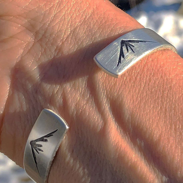 Mountain Peaks Cuff Bracelet worn on wrist, showcasing mountain peak design for outdoor enthusiasts.