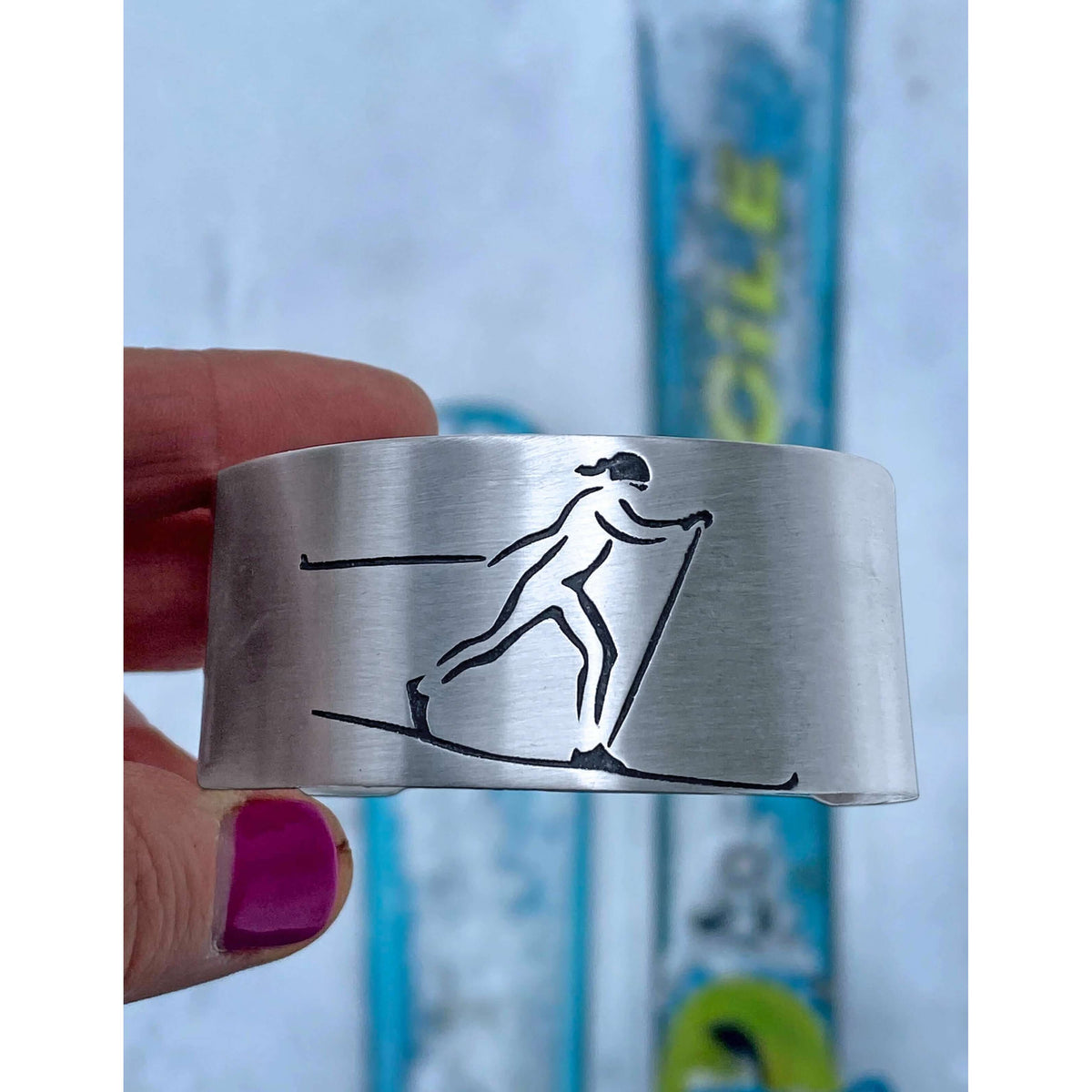 Nordic Run Cuff Bracelet featuring an etched Nordic skier on a handmade cuff.