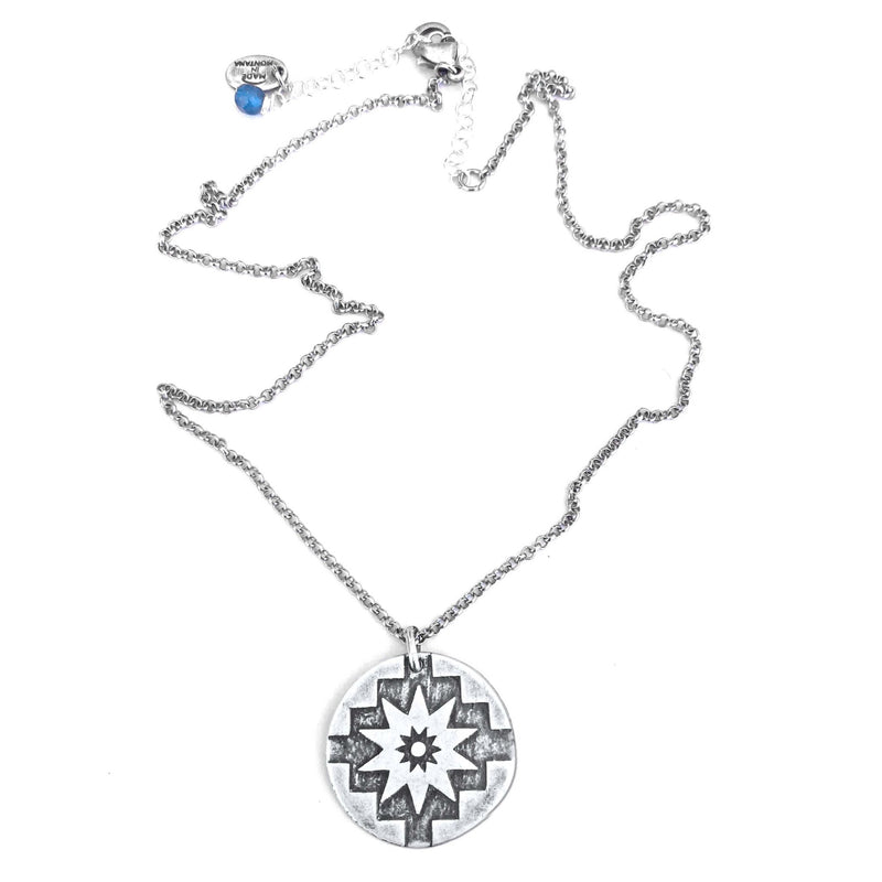 Northstar Necklace in matte silver with a star design, symbolizing courage and optimism.