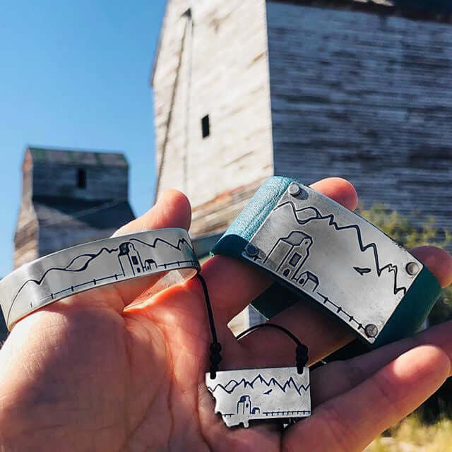 On the Front in Montana Necklace alongside leather bracelets featuring etched Montana landscapes.