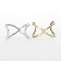 Open Space Adjustable Ring in Matte Silver and Antique Brass finishes, showcasing a unique and classy design.