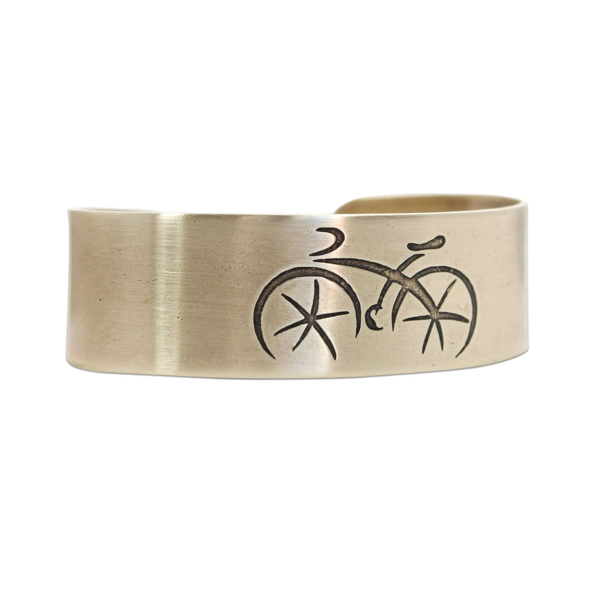 Ride Bicycle Cuff Bracelet featuring a stylish bicycle design etched on raw brass.