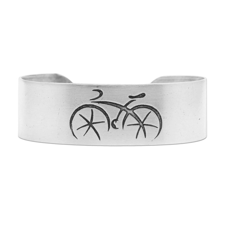 Ride Bicycle Cuff Bracelet featuring a simple bicycle design etched on brass.
