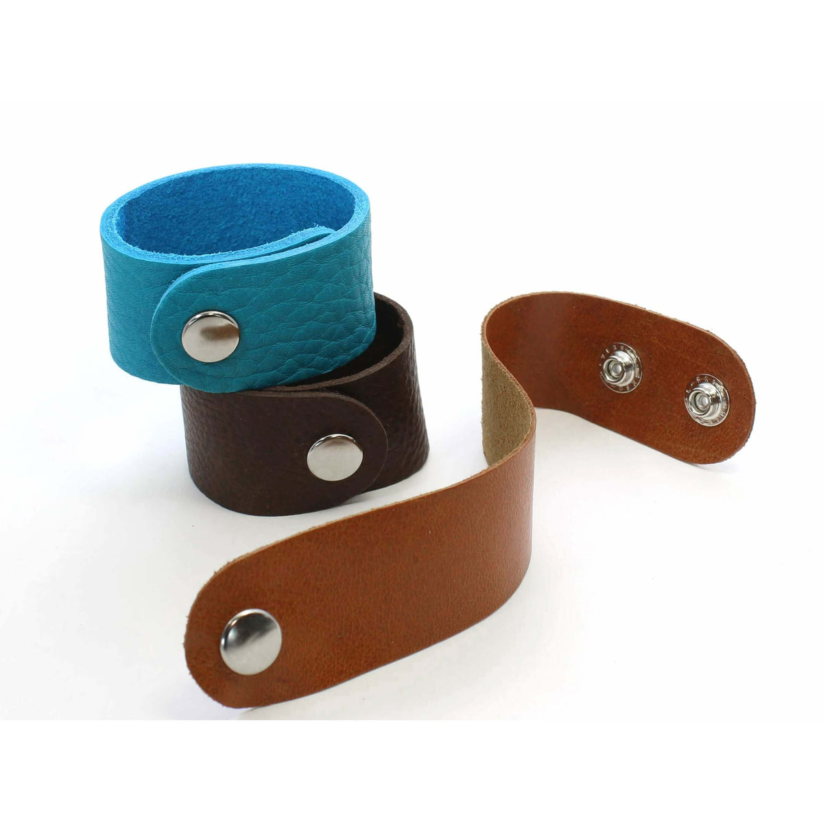 Rocky Bear Leather Cuff Bracelet in turquoise, brown, and tan showcasing adjustable design and distinctive style.