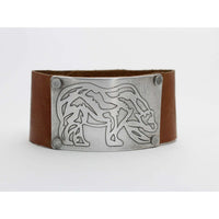 Rocky Bear Leather Cuff Bracelet featuring a silver grizzly bear design on a brown leather band.
