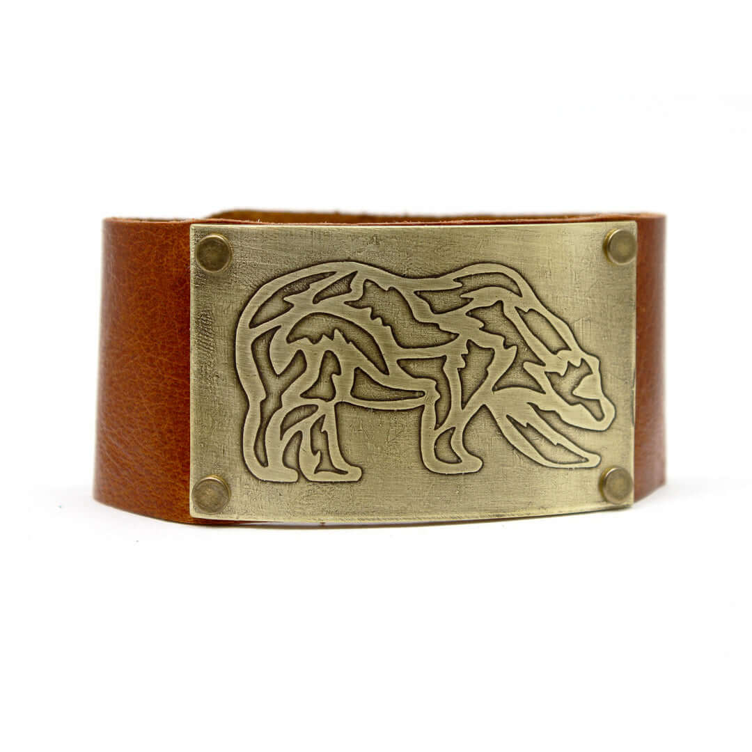 Rocky Bear Leather Cuff Bracelet featuring a grizzly bear design in antique brass on a leather band.