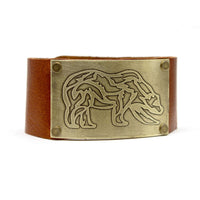 Rocky Bear Leather Cuff Bracelet featuring a grizzly bear design in antique brass on a leather band.