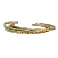 Set of Three Thin Cuff Bracelets featuring textured solid brass with a hammered finish.