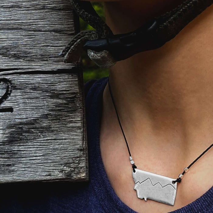 Simple Montana Necklace showcasing a mountain design on a cord, perfect for adventure lovers and Montana enthusiasts.