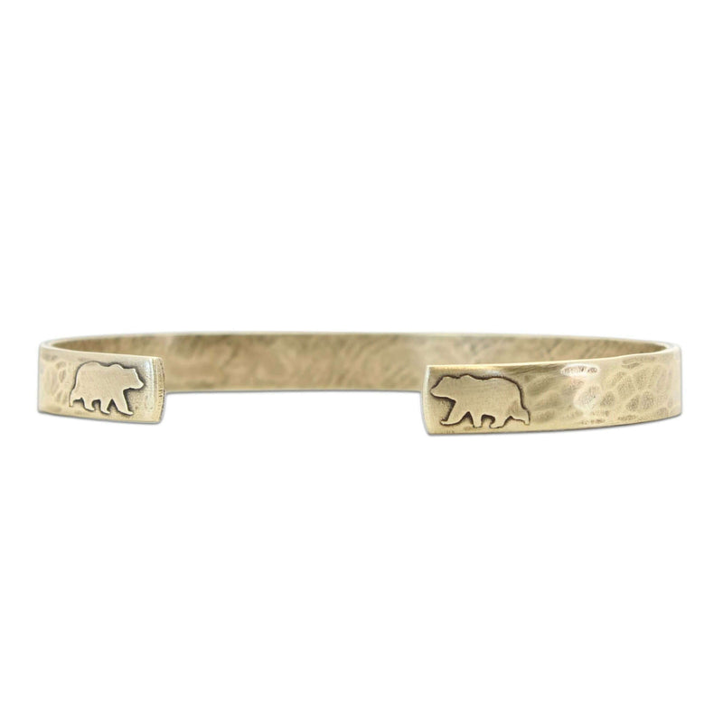 Skinny Bear Cuff Bracelet showcasing bear designs on a textured raw brass cuff.