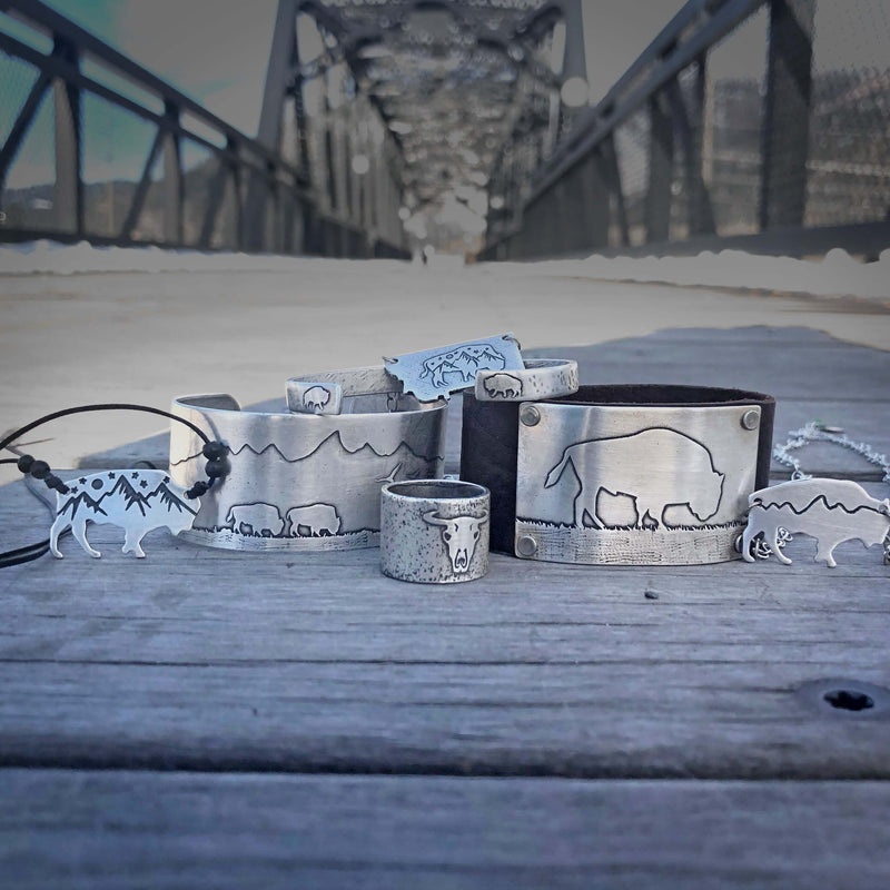 Skinny Bear Cuff Bracelet collection featuring unique designs and textures on metal accessories.