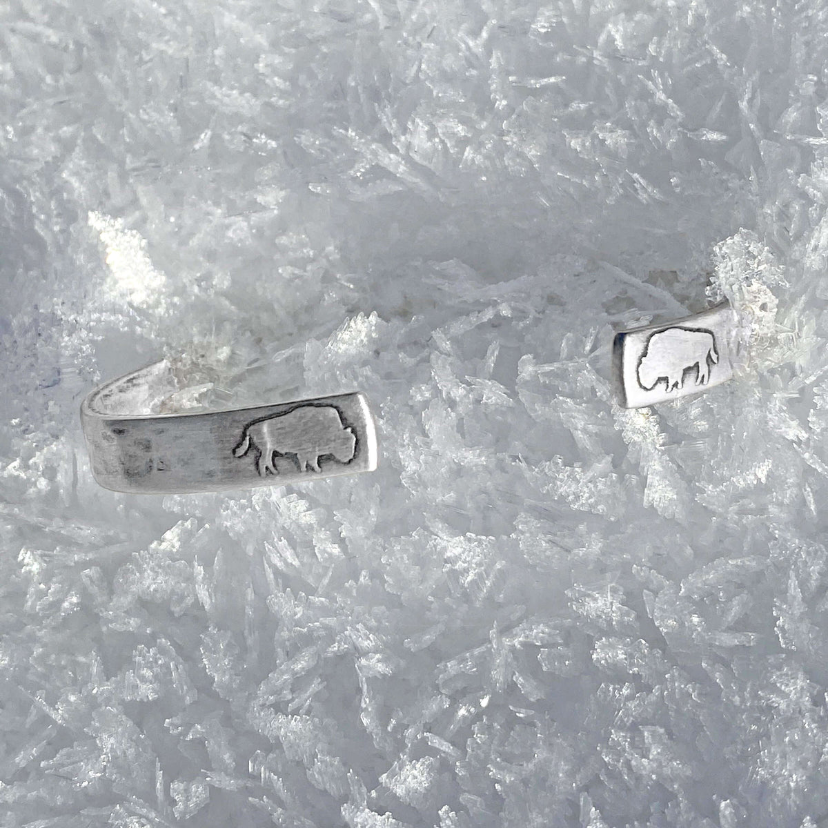 Skinny Buff Cuff Bracelet featuring bison design on a frosty background.