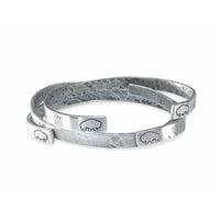 Skinny Fish Cuff Bracelet featuring a raw brass design with etched fish ends and a unique textured finish.