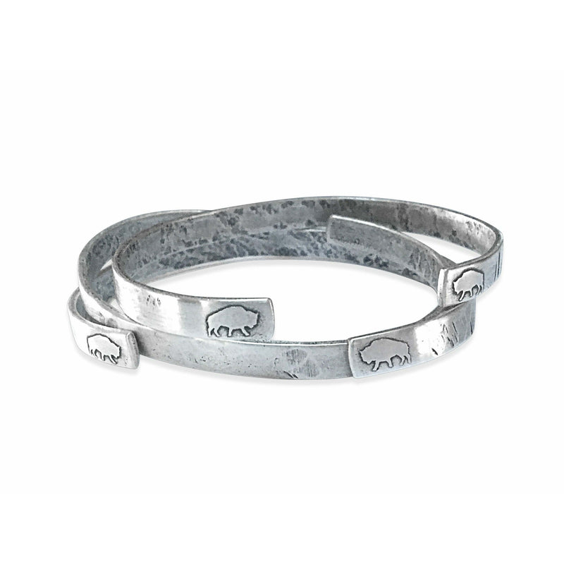 Skinny Fish Cuff Bracelet featuring a raw brass design with etched fish ends and a unique textured finish.