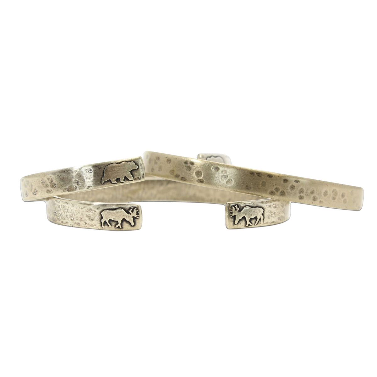 Skinny Fish Cuff Bracelet featuring unique etched animal designs and a textured raw brass finish.