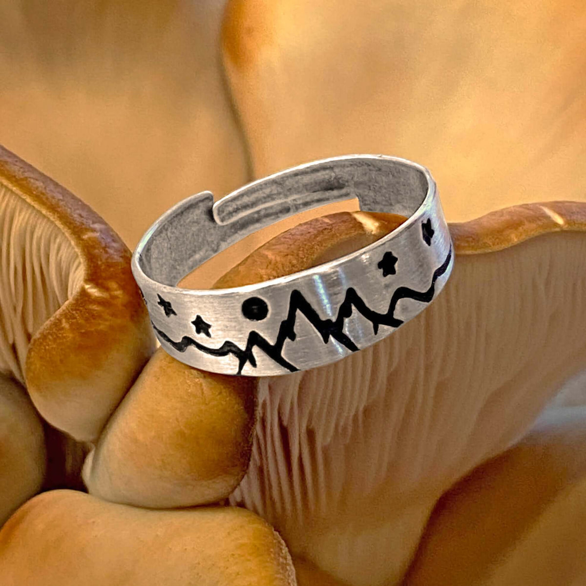 Skinny High Alpine Adjustable Ring featuring etched mountain and star designs on a silver band.