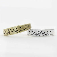 Skinny High Alpine Adjustable Ring in brass and silver with mountain and star designs