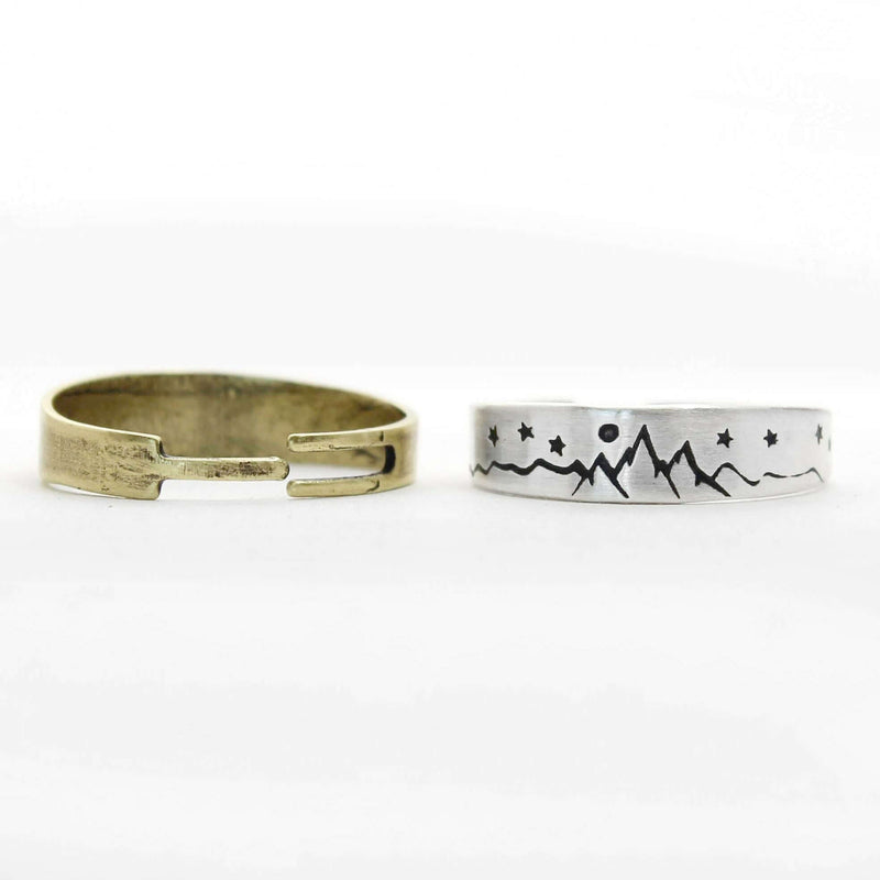 Skinny High Alpine Adjustable Ring design featuring mountains and stars, showcasing raw brass and silver finishes.