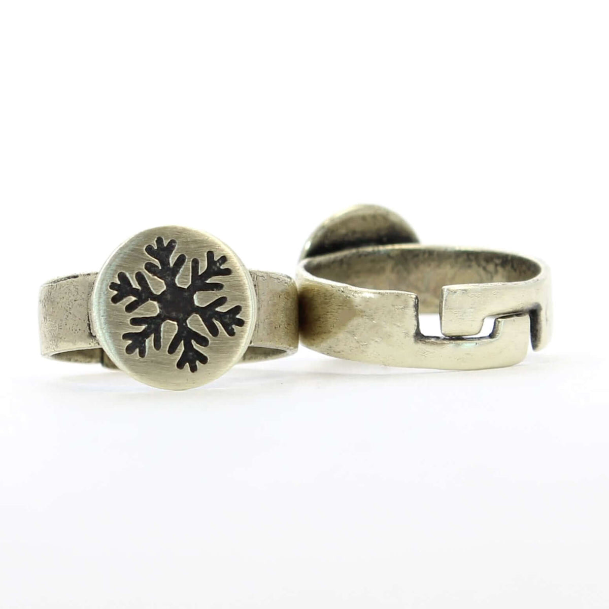 Snowflake Adjustable Ring featuring an etched snowflake on a round disk and an adjustable band.