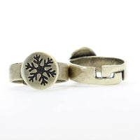 Snowflake Adjustable Ring featuring an etched snowflake on a round disk and an adjustable band.