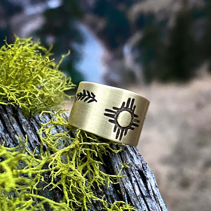 Sol Adjustable Ring featuring Zia sun design on raw brass, perfect for sun-worshippers and summer lovers.