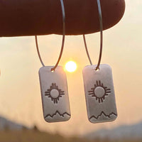 Sol Hoop Earrings featuring the Zia sun design, crafted in raw brass with sterling silver or 14k gold filled earwires.