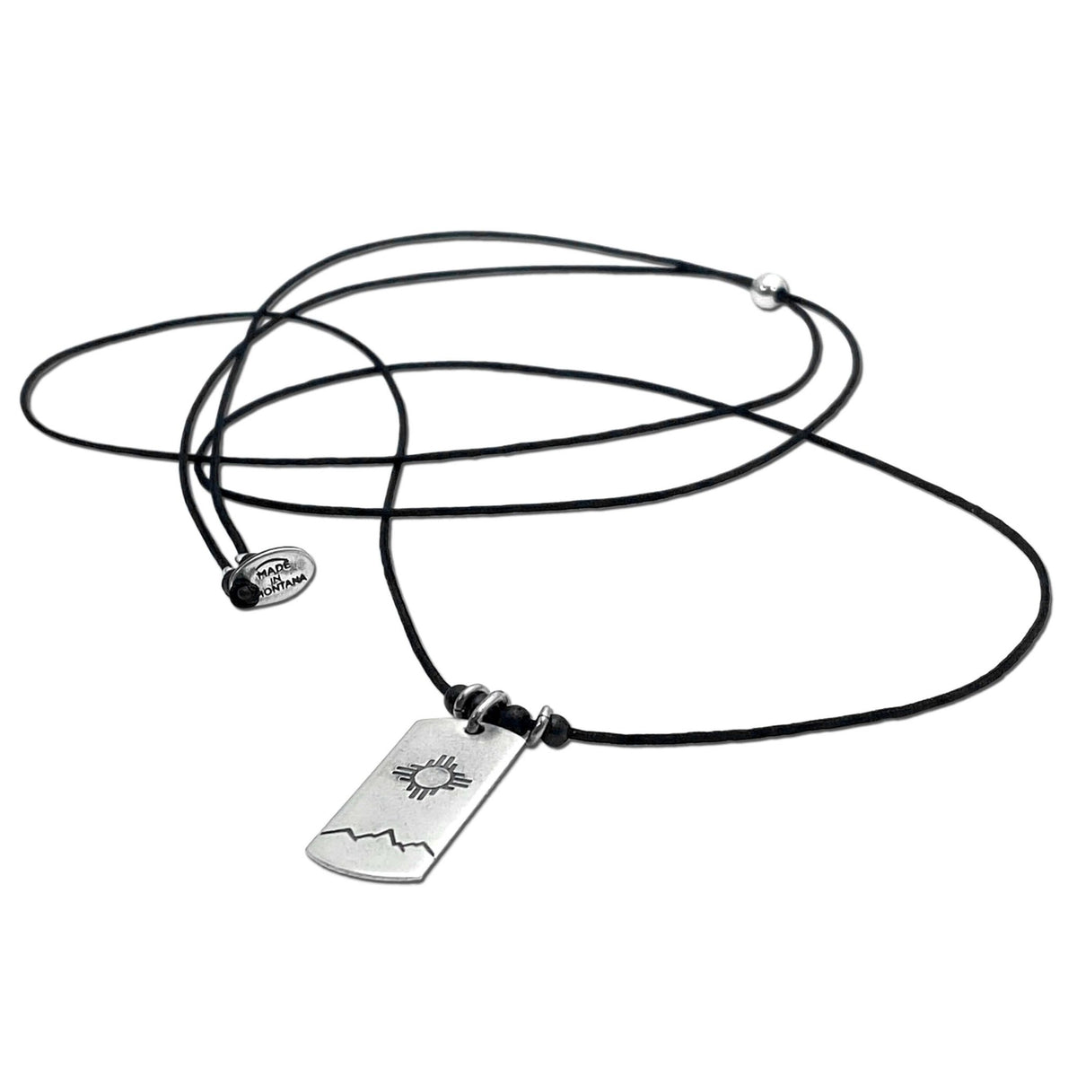 Sol Necklace featuring a Zia sun design on a black adjustable cord, perfect for any wardrobe.