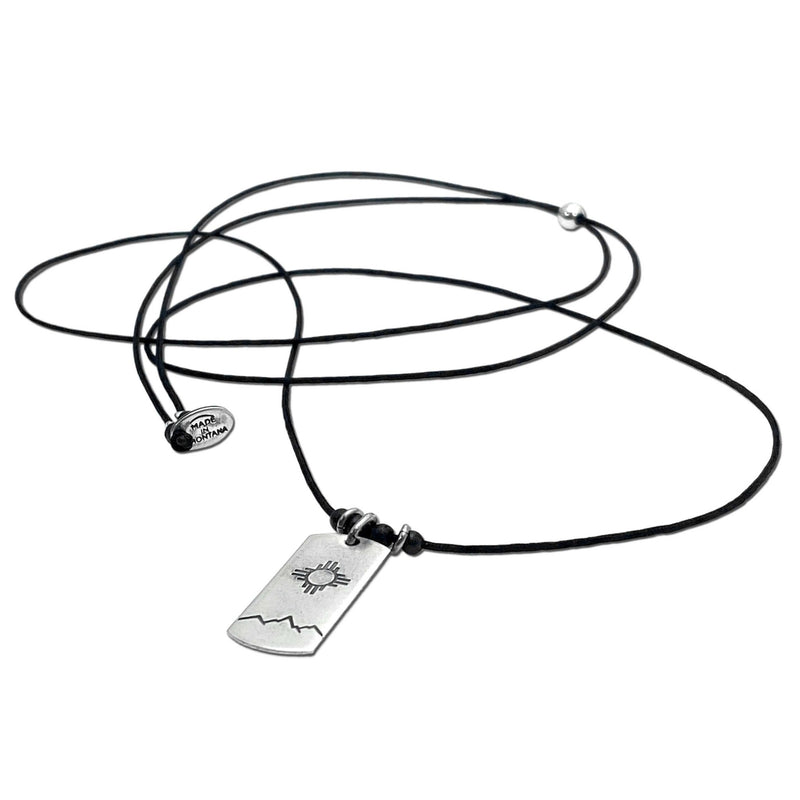 Sol Necklace featuring a Zia sun design on a black adjustable cord, perfect for any wardrobe.