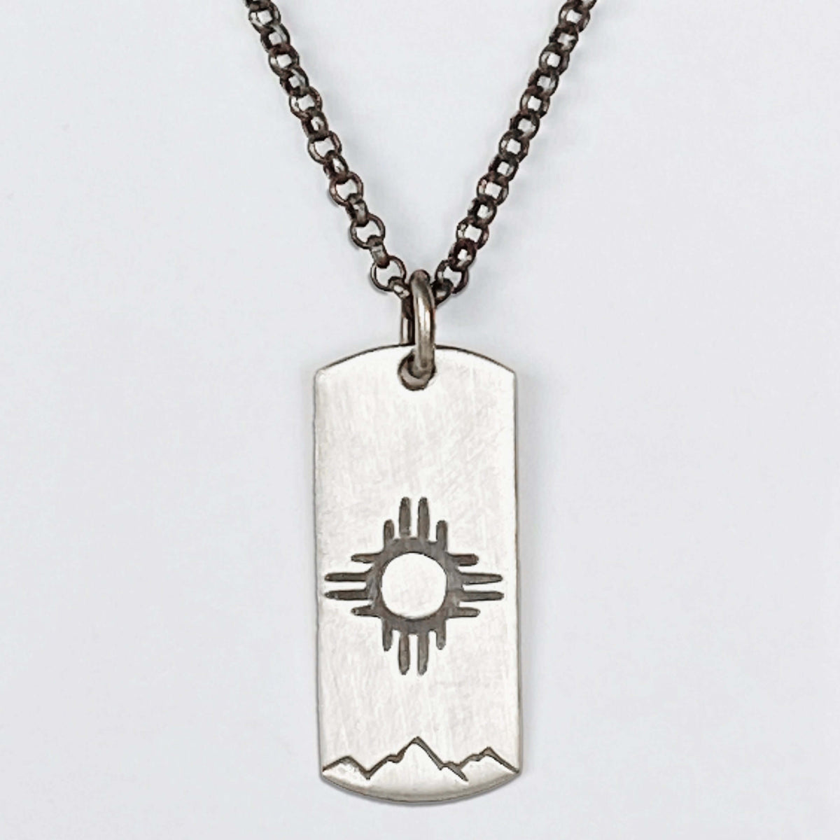 Sol Necklace featuring Zia sun design on silver, beautifully crafted for a stylish look.