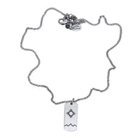 Sol Necklace featuring a silver chain with Zia sun design pendant, perfect for any wardrobe.