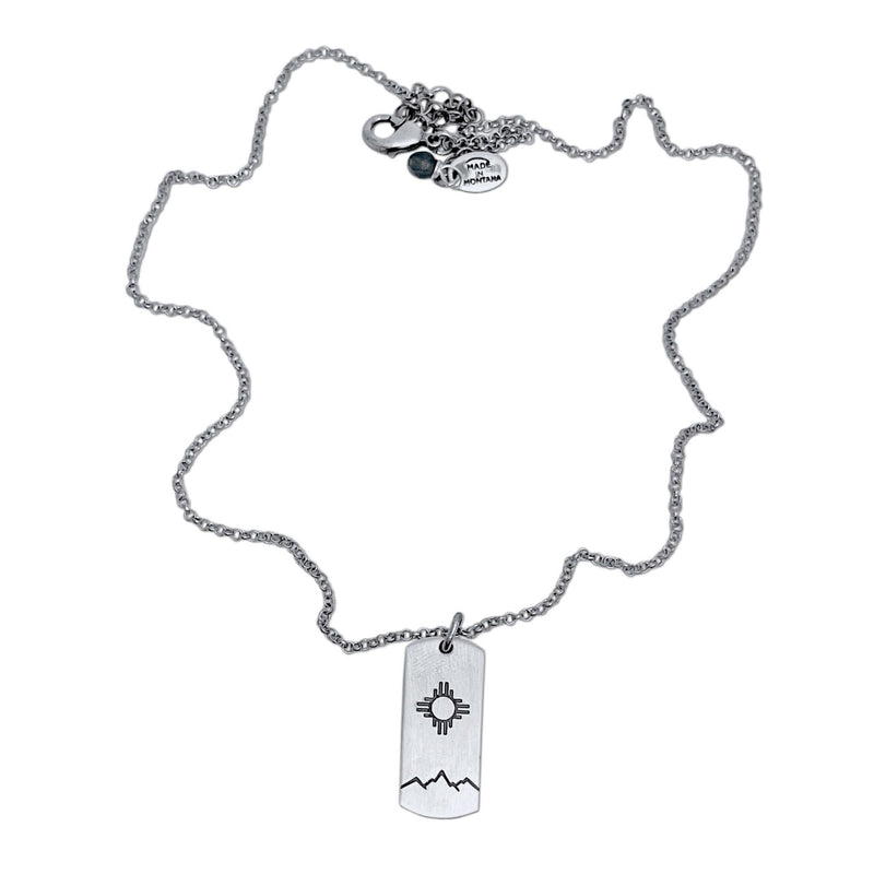 Sol Necklace featuring a silver chain with Zia sun design pendant, perfect for any wardrobe.