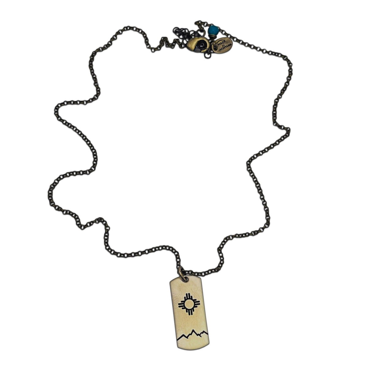 Sol Necklace featuring iconic Zia sun design on raw brass, adjustable chain options available.