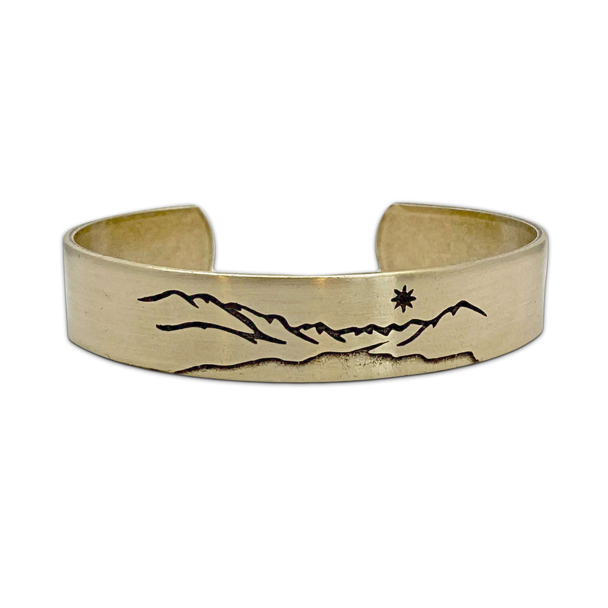 St. Mary Cuff Bracelet featuring a nature-inspired mountain and star design.