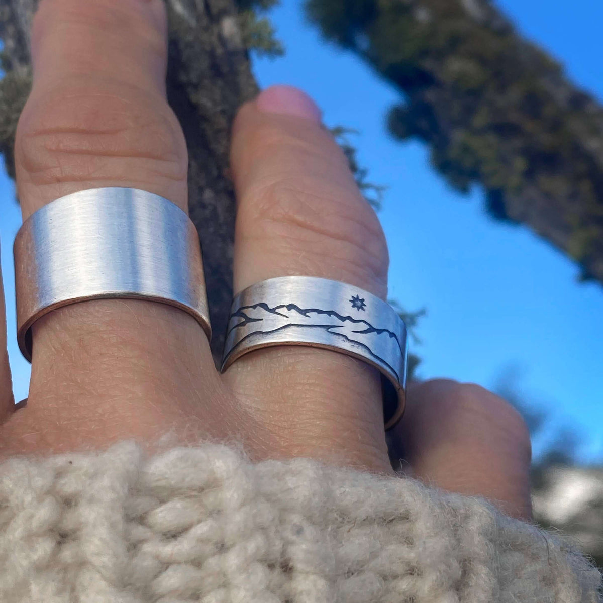 St. Mary Lake Adjustable Ring showcased on fingers against a natural background, highlighting Glacier National Park's beauty.