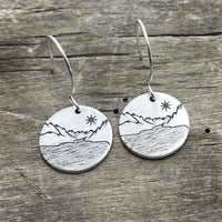 St. Mary Lake Earrings - Glacier Mountain and Lake with Sun showcasing etched brass design with mountains and sun.